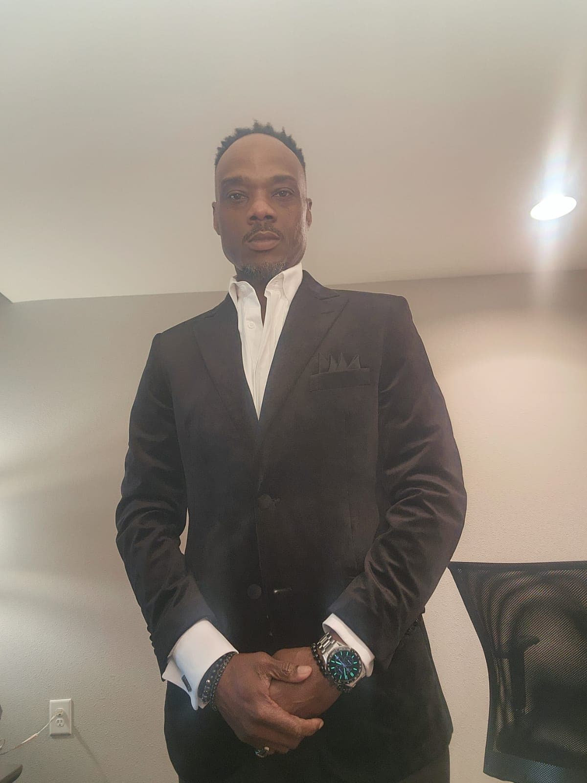 Fred Potts - Owner, FPE LLC Photo of Fred Potts, owner of FPE LLC, smiling and standing in front of his company vehicle