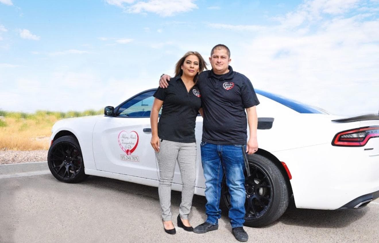 Karina - Owner, Helping Hands Transportation Photo of Karina, owner of Helping Hands Transportation, standing beside her company vehicle